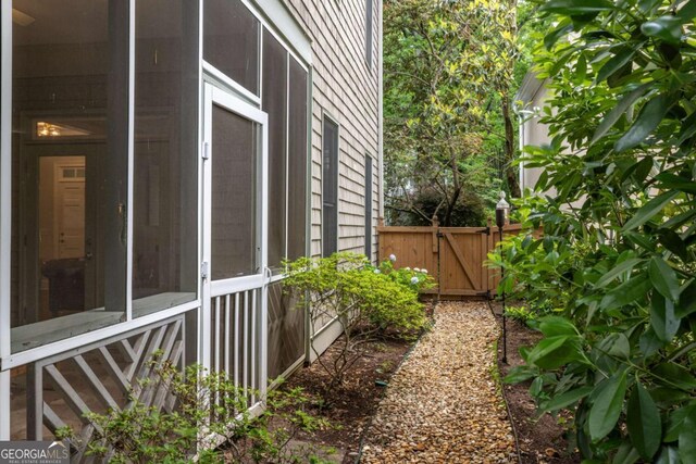 626 Kimberly Ln NE, Atlanta, GA 30306 - view of side of home with a gate and a sunroom