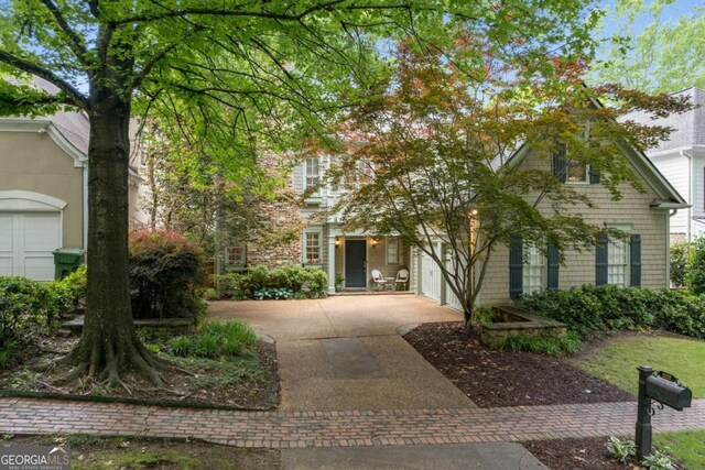 626 Kimberly Ln NE, Atlanta, GA 30306 - obstructed view of property featuring driveway and a garage