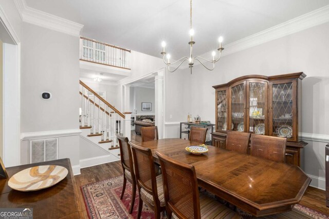626 Kimberly Ln NE, Atlanta, GA 30306 - dining room with stairway, a chandelier, wood finished floors, and crown molding