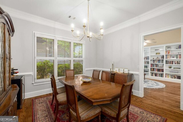 626 Kimberly Ln NE, Atlanta, GA 30306 - dining room featuring ornamental molding, wood finished floors, and a chandelier