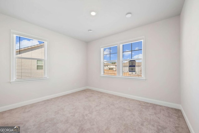 1246 Allspice Way, Lawrenceville, GA 30045 - unfurnished room with carpet floors, healthy amount of natural light, baseboards, and recessed lighting