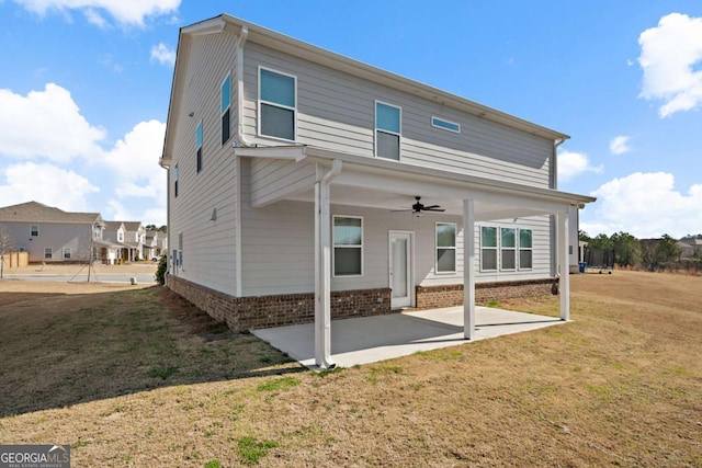 1246 Allspice Way, Lawrenceville, GA 30045 - rear view of house with ceiling fan, a patio, a lawn, and brick siding