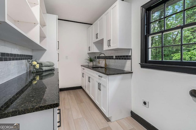 788 Sherwood Rd, Gainesville, GA 30501 - kitchen with a sink, tasteful backsplash, and white cabinetry