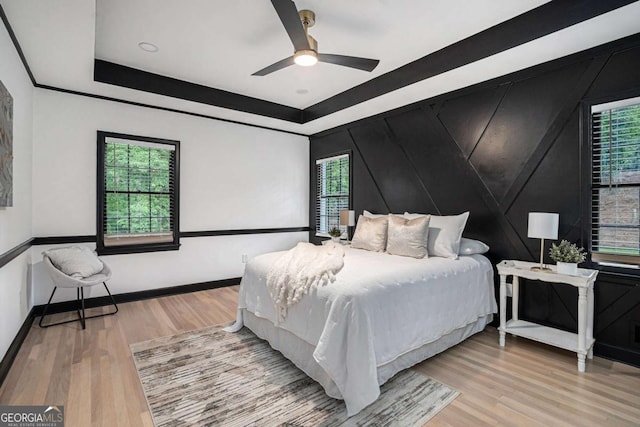 788 Sherwood Rd, Gainesville, GA 30501 - bedroom featuring wood finished floors, a tray ceiling, and ceiling fan