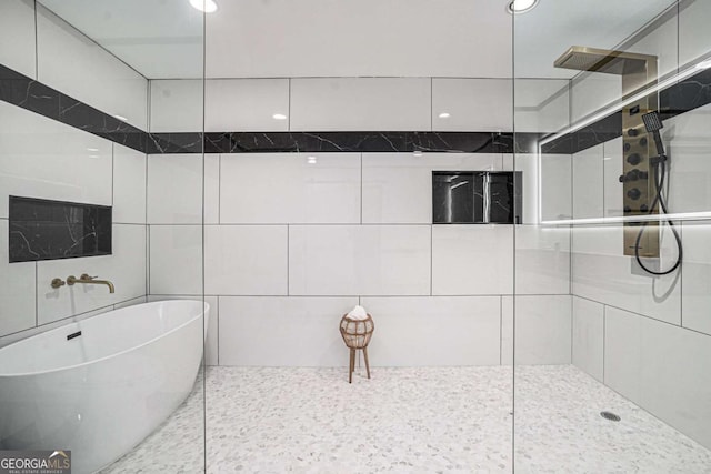 788 Sherwood Rd, Gainesville, GA 30501 - bathroom with a freestanding tub, walk in shower, tile walls, and recessed lighting
