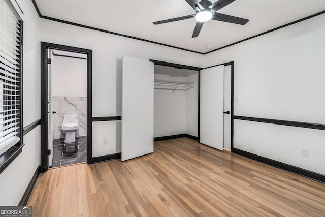 788 Sherwood Rd, Gainesville, GA 30501 - unfurnished bedroom with wood finished floors, baseboards, a closet, and a ceiling fan