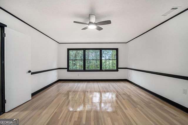 788 Sherwood Rd, Gainesville, GA 30501 - empty room featuring light wood-type flooring, ceiling fan, baseboards, and a textured ceiling
