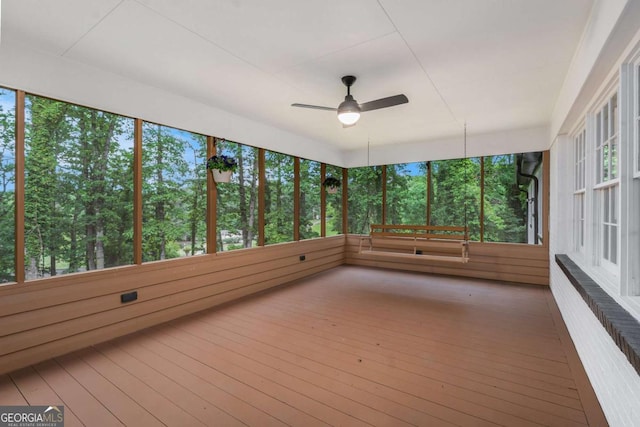 788 Sherwood Rd, Gainesville, GA 30501 - unfurnished sunroom featuring a ceiling fan, healthy amount of natural light, and view of scattered trees