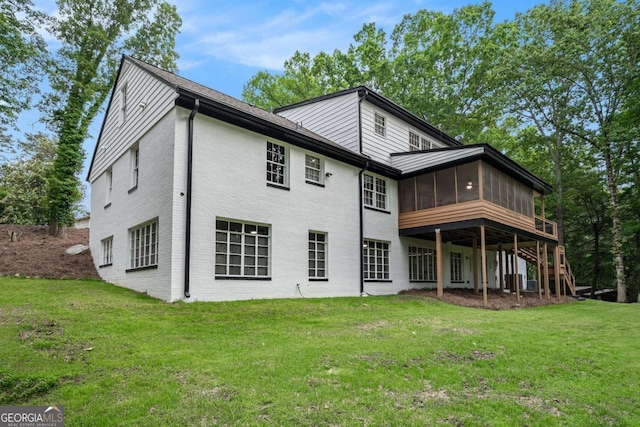 788 Sherwood Rd, Gainesville, GA 30501 - rear view of property with a sunroom, a yard, stairs, and brick siding