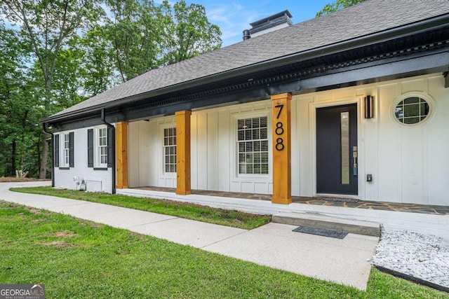 788 Sherwood Rd, Gainesville, GA 30501 - entrance to property with covered porch, roof with shingles, board and batten siding, a chimney, and a lawn