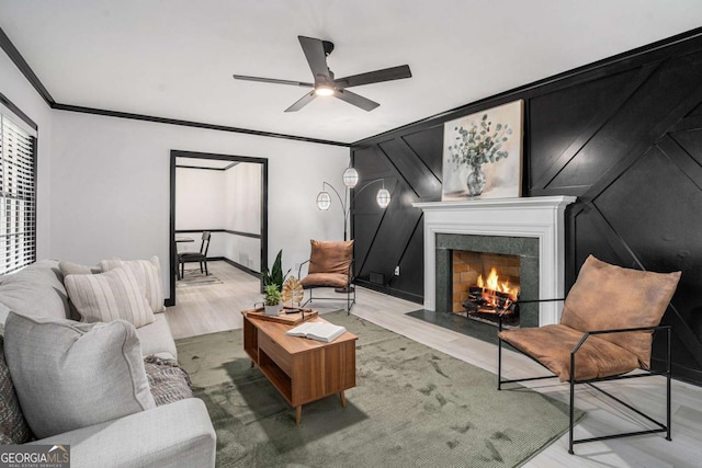 788 Sherwood Rd, Gainesville, GA 30501 - living area featuring wood finished floors, crown molding, a fireplace with flush hearth, and ceiling fan