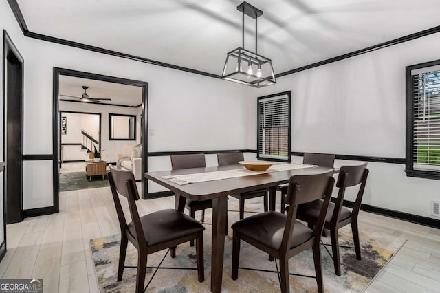 788 Sherwood Rd, Gainesville, GA 30501 - dining space featuring crown molding, light wood-style flooring, and stairway