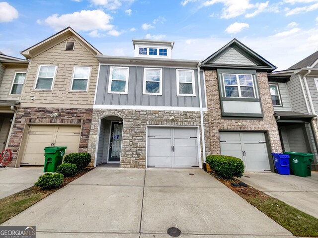 4922 Longview Walk, Decatur, GA 30035 - townhome / multi-family property featuring an attached garage, driveway, and stone siding