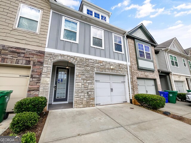 4922 Longview Walk, Decatur, GA 30035 - view of property featuring board and batten siding, stone siding, and driveway