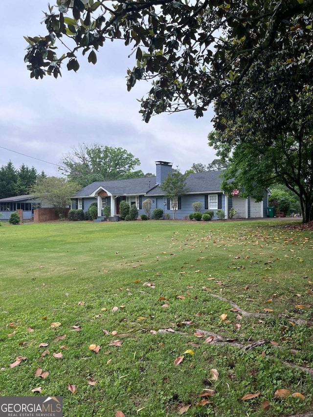 4925 Happy Hollow Rd, Dunwoody, GA 30360 - view of front facade featuring a chimney and a front yard