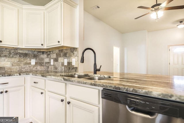 kitchen featuring stainless steel dishwasher, a sink, backsplash, light stone counters, and a ceiling fan