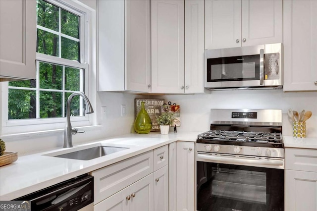4368 Heritage Glen Ct, Marietta, GA 30068 - kitchen with stainless steel appliances, a sink, healthy amount of natural light, and light countertops