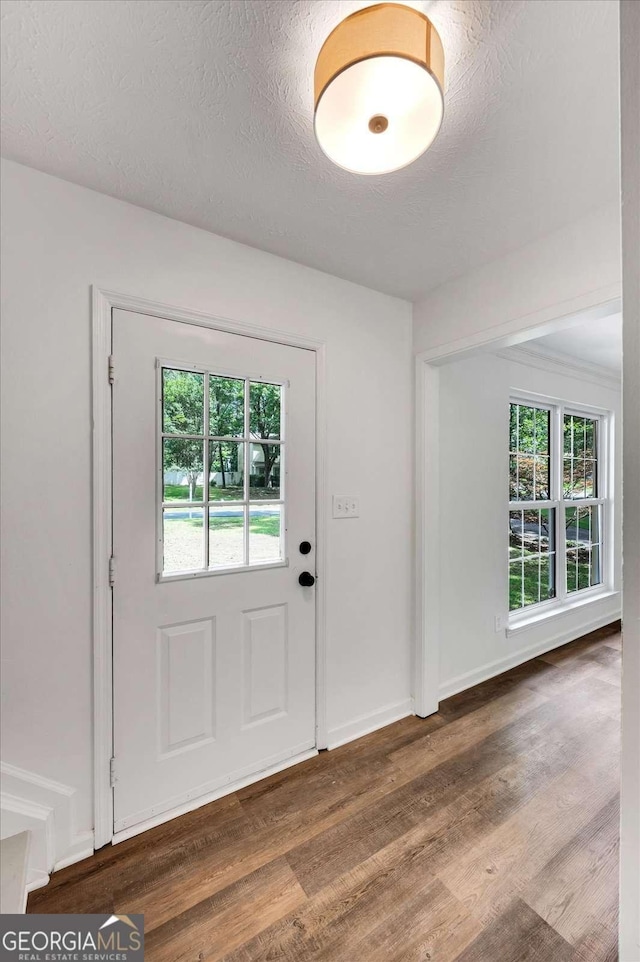 4368 Heritage Glen Ct, Marietta, GA 30068 - foyer with wood finished floors, a textured ceiling, and baseboards