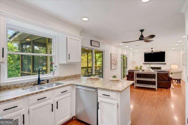 1380 Heritage Glen Dr, Marietta, GA 30068 - kitchen featuring dishwasher, a sink, a peninsula, white cabinets, and a ceiling fan