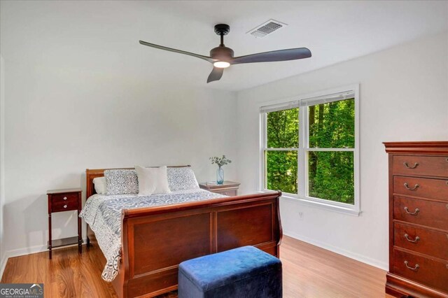 1380 Heritage Glen Dr, Marietta, GA 30068 - bedroom with wood finished floors, baseboards, and a ceiling fan