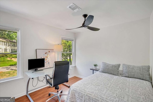 1380 Heritage Glen Dr, Marietta, GA 30068 - bedroom featuring wood finished floors, multiple windows, and baseboards