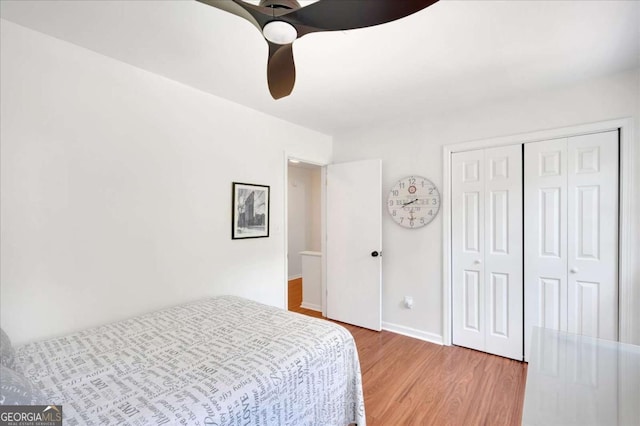 1380 Heritage Glen Dr, Marietta, GA 30068 - bedroom featuring light wood-style floors, a closet, ceiling fan, and baseboards