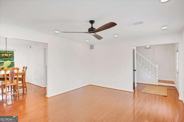 1380 Heritage Glen Dr, Marietta, GA 30068 - living room featuring stairs, wood finished floors, ceiling fan, baseboards, and recessed lighting