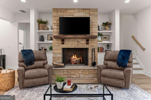 1087 Webb W Rd, Cleveland, GA 30528 - living area with wood finished floors, a fireplace, baseboards, recessed lighting, and stairway