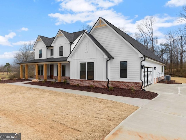1087 Webb W Rd, Cleveland, GA 30528 - modern inspired farmhouse featuring covered porch, board and batten siding, and central AC unit