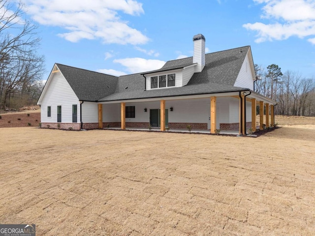 1087 Webb W Rd, Cleveland, GA 30528 - rear view of house with a chimney, a shingled roof, and brick siding