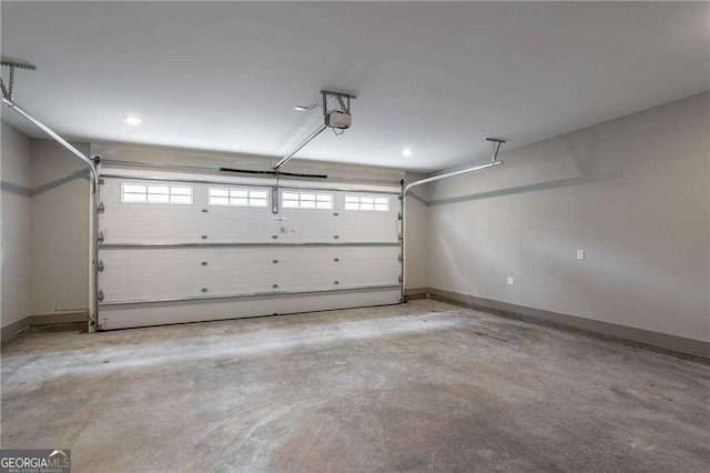 garage with baseboards, a garage door opener, and recessed lighting
