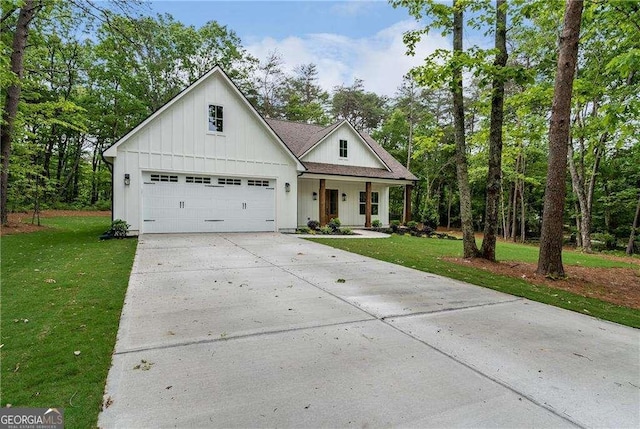 modern farmhouse with a front lawn, driveway, covered porch, board and batten siding, and an attached garage