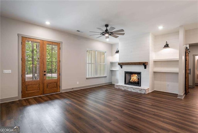 unfurnished living room featuring french doors, baseboards, wood finished floors, ceiling fan, and recessed lighting
