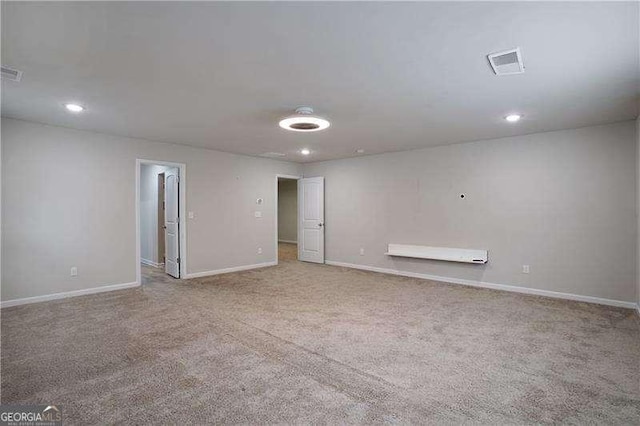 carpeted spare room with baseboards and recessed lighting