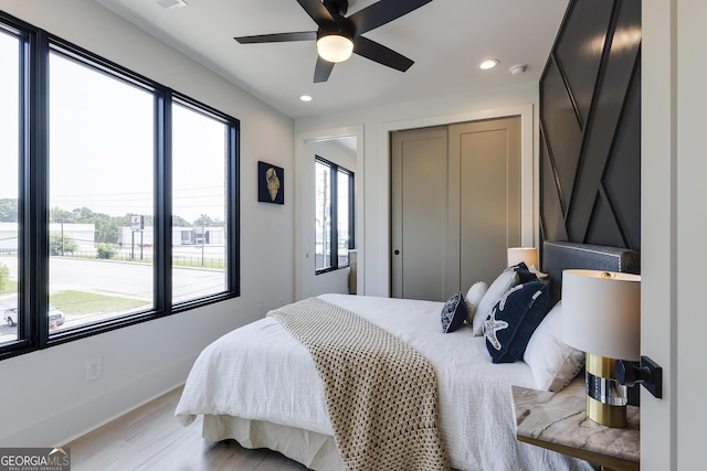 1968 8th St, Chamblee, GA 30341 - bedroom featuring recessed lighting, light wood-style flooring, a closet, and ceiling fan