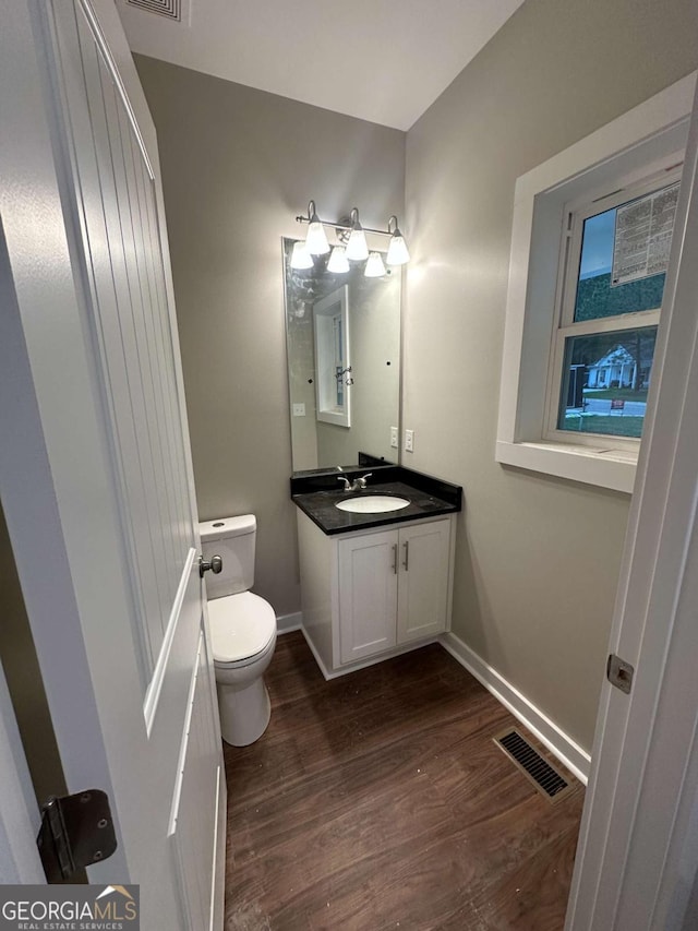 113 Sidetrack Cir, Comer, GA 30629 - half bath featuring toilet, wood finished floors, vanity, and baseboards