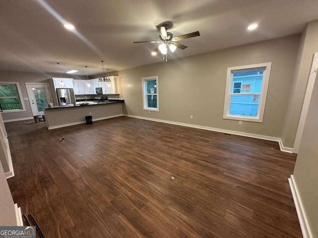 113 Sidetrack Cir, Comer, GA 30629 - unfurnished living room featuring dark wood-style floors, ceiling fan, baseboards, and recessed lighting