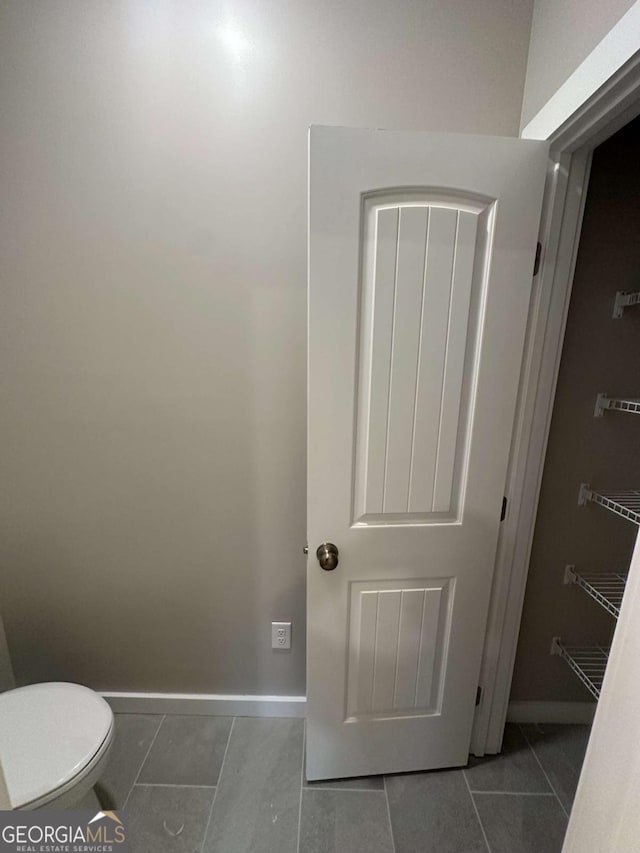 113 Sidetrack Cir, Comer, GA 30629 - bathroom featuring tile patterned flooring, baseboards, and toilet