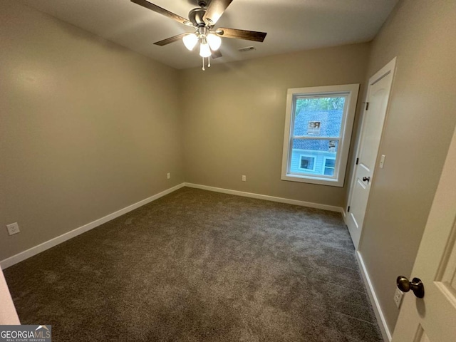 113 Sidetrack Cir, Comer, GA 30629 - empty room with dark carpet, baseboards, and a ceiling fan