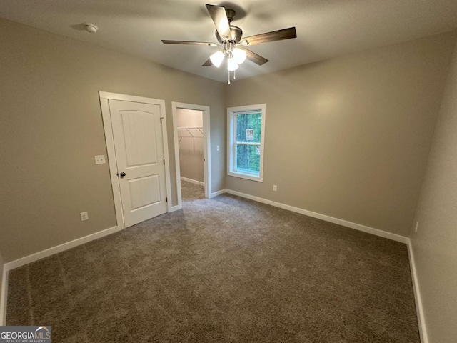 113 Sidetrack Cir, Comer, GA 30629 - spare room featuring a ceiling fan, dark colored carpet, baseboards, and a smoke detector