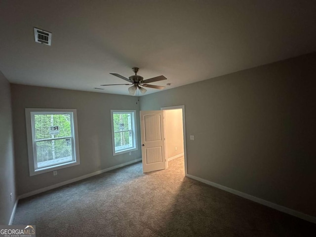 113 Sidetrack Cir, Comer, GA 30629 - unfurnished bedroom featuring baseboards, carpet floors, and a ceiling fan