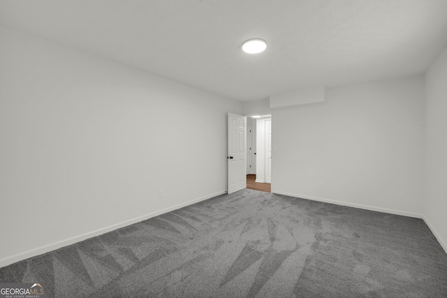 1645 Cobbs Creek Ln, Decatur, GA 30032 - spare room featuring dark carpet and baseboards