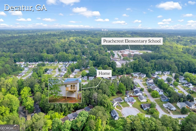 1645 Cobbs Creek Ln, Decatur, GA 30032 - aerial perspective of suburban area featuring a heavily wooded area and property parcel outlined