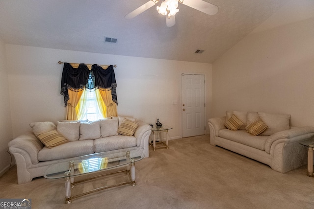 living area with ceiling fan, carpet flooring, and lofted ceiling