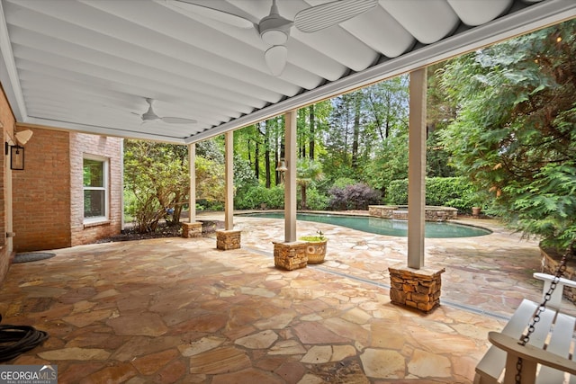 view of patio with a ceiling fan and an outdoor pool