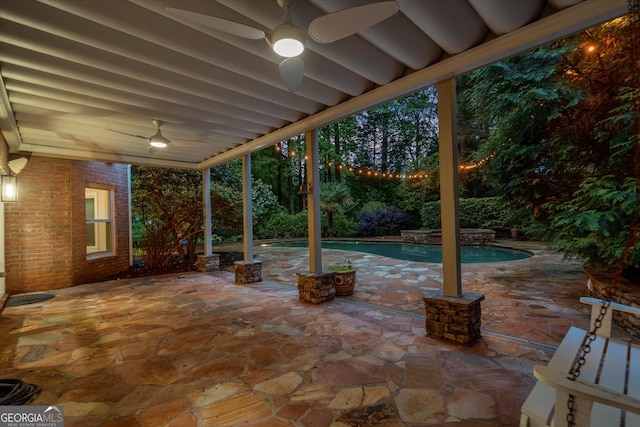view of patio / terrace with a ceiling fan and an outdoor pool