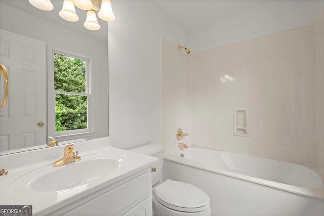 full bath with toilet, vanity, tub / shower combination, and a chandelier
