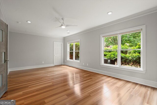 unfurnished room featuring a ceiling fan, baseboards, crown molding, light wood-type flooring, and recessed lighting
