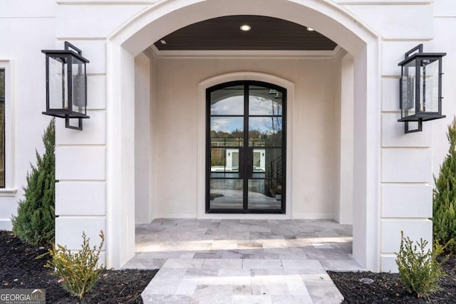 5211 Powers Ferry Rd, Sandy Springs, GA 30327 - view of exterior entry featuring stucco siding and french doors