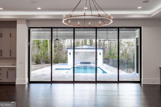5211 Powers Ferry Rd, Sandy Springs, GA 30327 - doorway to outside with healthy amount of natural light, dark wood-type flooring, baseboards, a chandelier, and recessed lighting